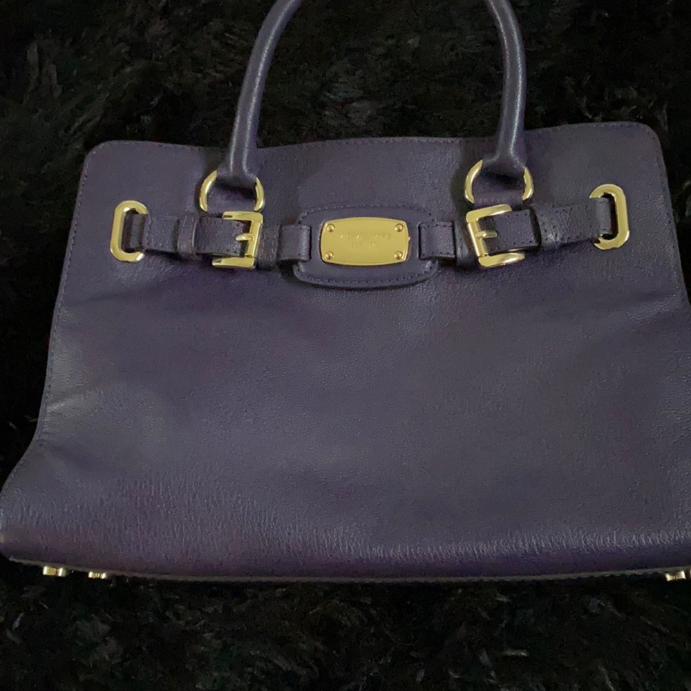 Dark purple purse that I have never worn.